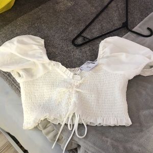 White off the shoulder crop top.